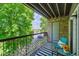 Private balcony with seating and treetop views at 8813 Colorado Blvd # 207, Thornton, CO 80229