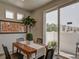 Dining area with wood table and sliding glass doors leading to patio at , Commerce City, CO 80022