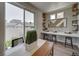 Bright dining area with built-in shelving and sliding glass door to backyard at , Commerce City, CO 80022