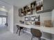 Modern office with built-in shelving and workspace for two at , Commerce City, CO 80022