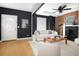 Living room featuring a brick fireplace and hardwood floors at 1473 Yates St, Denver, CO 80204