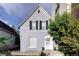 Charming gray two-story house with white trim and landscaping at 1473 Yates St, Denver, CO 80204