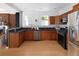 Modern kitchen with stainless steel appliances and wood cabinets at 1473 Yates St, Denver, CO 80204