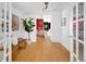 Bright entryway with hardwood floors and views into the dining room at 1473 Yates St, Denver, CO 80204
