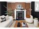 Living room fireplace with exposed brick and modern decor at 1473 Yates St, Denver, CO 80204