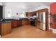 Modern kitchen with stainless steel appliances and wood cabinets at 1473 Yates St, Denver, CO 80204