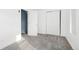 Simple bedroom with grey carpet and double door closet at 1473 Yates St, Denver, CO 80204