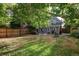 Spacious backyard with patio, grass area and home view at 1473 Yates St, Denver, CO 80204