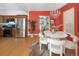 Dining area with a round table and white chairs, near the kitchen at 1473 Yates St, Denver, CO 80204