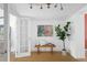 Entryway with wood floors, a bench, and French doors at 1473 Yates St, Denver, CO 80204