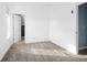 Bright bedroom with grey carpet and an ensuite bathroom at 1473 Yates St, Denver, CO 80204