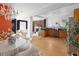 Open kitchen with wood cabinets and a view of the living area at 1473 Yates St, Denver, CO 80204
