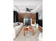 Living room with exposed brick fireplace and modern decor at 1473 Yates St, Denver, CO 80204