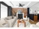 Living area features exposed brick wall, fireplace, and modern decor at 1473 Yates St, Denver, CO 80204