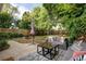 Backyard patio with seating area and fire pit at 1473 Yates St, Denver, CO 80204