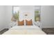 Spacious bedroom with white bedding and two nightstands at 1473 Yates St, Denver, CO 80204