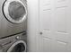 Laundry room with stacked washer and dryer at 1473 Yates St, Denver, CO 80204