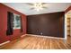 Hardwood floors and two-tone walls in this bedroom at 656 N Russellville Rd, Franktown, CO 80116