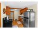 Galley kitchen with wood cabinets and modern appliances at 420 Chinook Rd, Idaho Springs, CO 80452