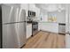 Bright kitchen featuring stainless steel appliances and L-shaped granite counters at 914 Savona Ave, Fort Lupton, CO 80621