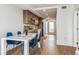 Open concept dining area with kitchen access and hardwood floors at 3575 Chestnut Pl # 704, Denver, CO 80216