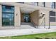 Modern building exterior with a welcoming entrance and landscaping at 3575 Chestnut Pl # 704, Denver, CO 80216