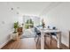 Bright dining area with hardwood floors and modern furnishings at 3575 Chestnut Pl # 704, Denver, CO 80216