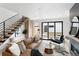 Living room with modern fireplace, sliding glass doors, and leather couch at 4121 Kalamath St, Denver, CO 80211