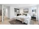 Spacious bedroom with a king-size bed, ensuite bathroom access, and a walk-in closet at 4121 Kalamath St, Denver, CO 80211