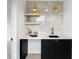 Contemporary wet bar with black cabinetry and a quartz countertop at 4121 Kalamath St, Denver, CO 80211