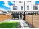 Modern backyard with pergola, grass, and wood fence at 4121 Kalamath St, Denver, CO 80211