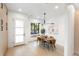 Light-filled dining area with modern table and chairs at 4121 Kalamath St, Denver, CO 80211
