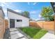 Landscaped side yard with grassy area and storage shed at 4121 Kalamath St, Denver, CO 80211