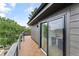 Private rooftop deck with wood tile flooring and city views at 4121 Kalamath St, Denver, CO 80211