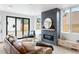 Living room with modern fireplace, sliding glass doors, and leather couch at 4121 Kalamath St, Denver, CO 80211