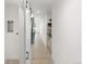 Bright hallway with modern light fixtures and built-in shelving at 4121 Kalamath St, Denver, CO 80211