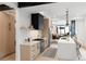 Modern kitchen with light wood cabinets, marble island, and stainless steel appliances at 4121 Kalamath St, Denver, CO 80211