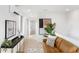 Spacious living area with a leather couch and large windows at 4121 Kalamath St, Denver, CO 80211