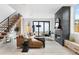 Spacious living room with a modern fireplace and sliding glass doors to the backyard at 4121 Kalamath St, Denver, CO 80211
