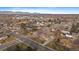 Wide shot of the house and surrounding neighborhood, showing mountain views at 8995 Grandview Ave, Arvada, CO 80002