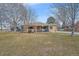 Ranch style brick home with a covered patio and landscaping at 8995 Grandview Ave, Arvada, CO 80002