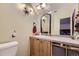 Bathroom with a vanity, toilet and a large mirror at 2730 Miner St, Idaho Springs, CO 80452