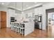 Open kitchen with white cabinets, marble countertops and stainless steel appliances at 29775 E 162Nd Ave, Brighton, CO 80603