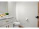 Modern bathroom with white vanity, gold fixtures and marble countertops at 29775 E 162Nd Ave, Brighton, CO 80603