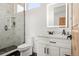 Modern bathroom with geometric tile shower and white vanity at 29775 E 162Nd Ave, Brighton, CO 80603