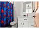 bathroom with Spiderman shower curtain and white vanity at 29775 E 162Nd Ave, Brighton, CO 80603