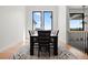 Bright dining area with hardwood floors and large windows offering scenic views at 29775 E 162Nd Ave, Brighton, CO 80603