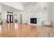 Living area with hardwood floors, a marble fireplace, and large windows at 29775 E 162Nd Ave, Brighton, CO 80603