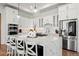Modern kitchen with white cabinets, marble island and stainless steel appliances at 29775 E 162Nd Ave, Brighton, CO 80603