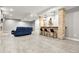 Open floor plan basement with a comfortable seating area and bar at 29775 E 162Nd Ave, Brighton, CO 80603